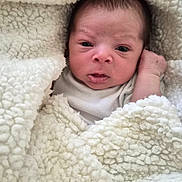 Deantre is registered to the contest to win money with this photo: baby, blanket, child, cozy, cute, expression, face, head, indoors, infant, newborn, person, portrait, skin, sleeping, soft, warm, white, wrapped, young