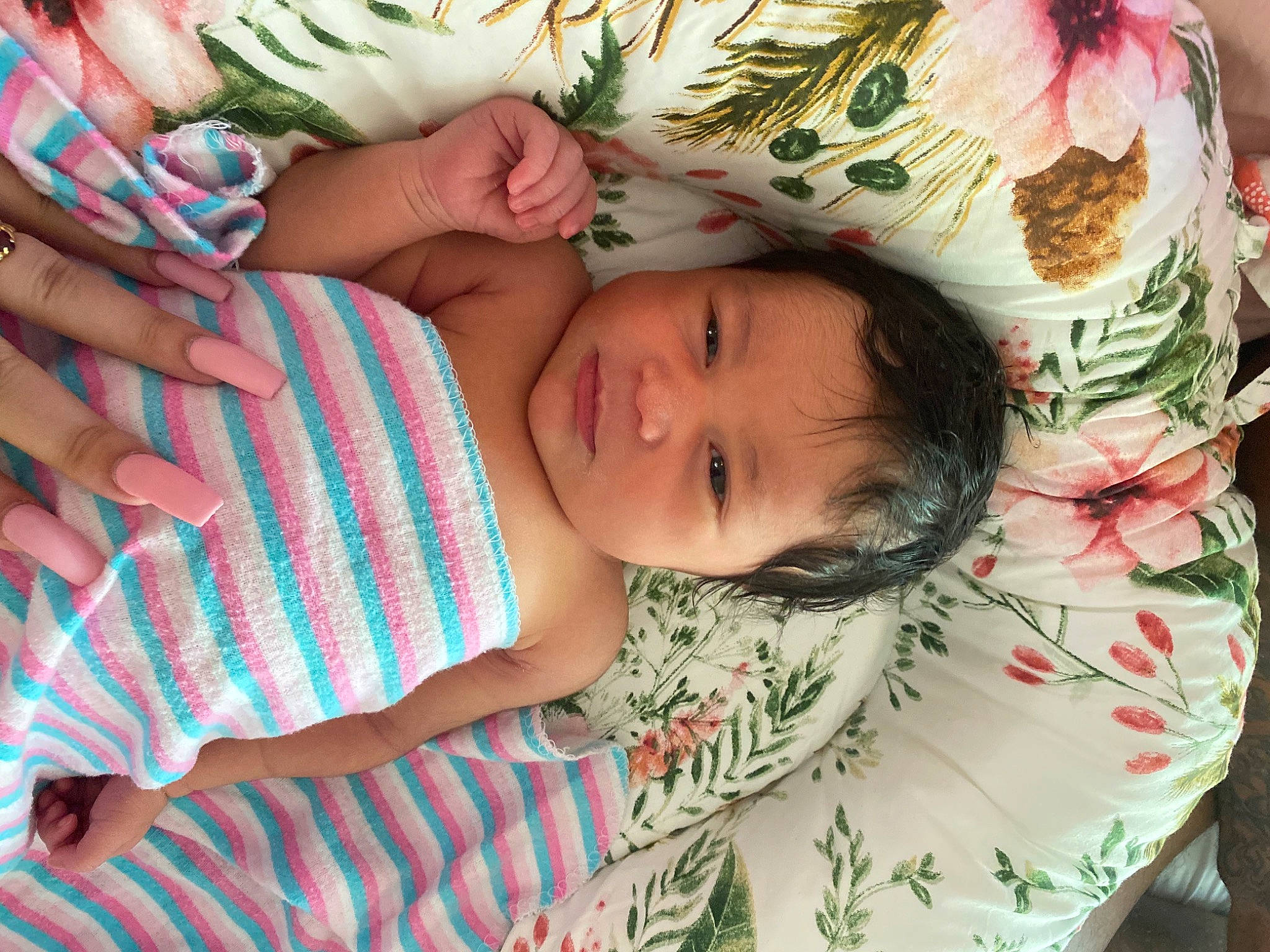 Zendaya is registered to the contest to win money with this photo: baby, baby_toddler_clothing, cheek, child, eyelash, finger, grass, green, hand, happy, human_body, iris, leaf, linens, organ, pattern, person, pink, skin, textile