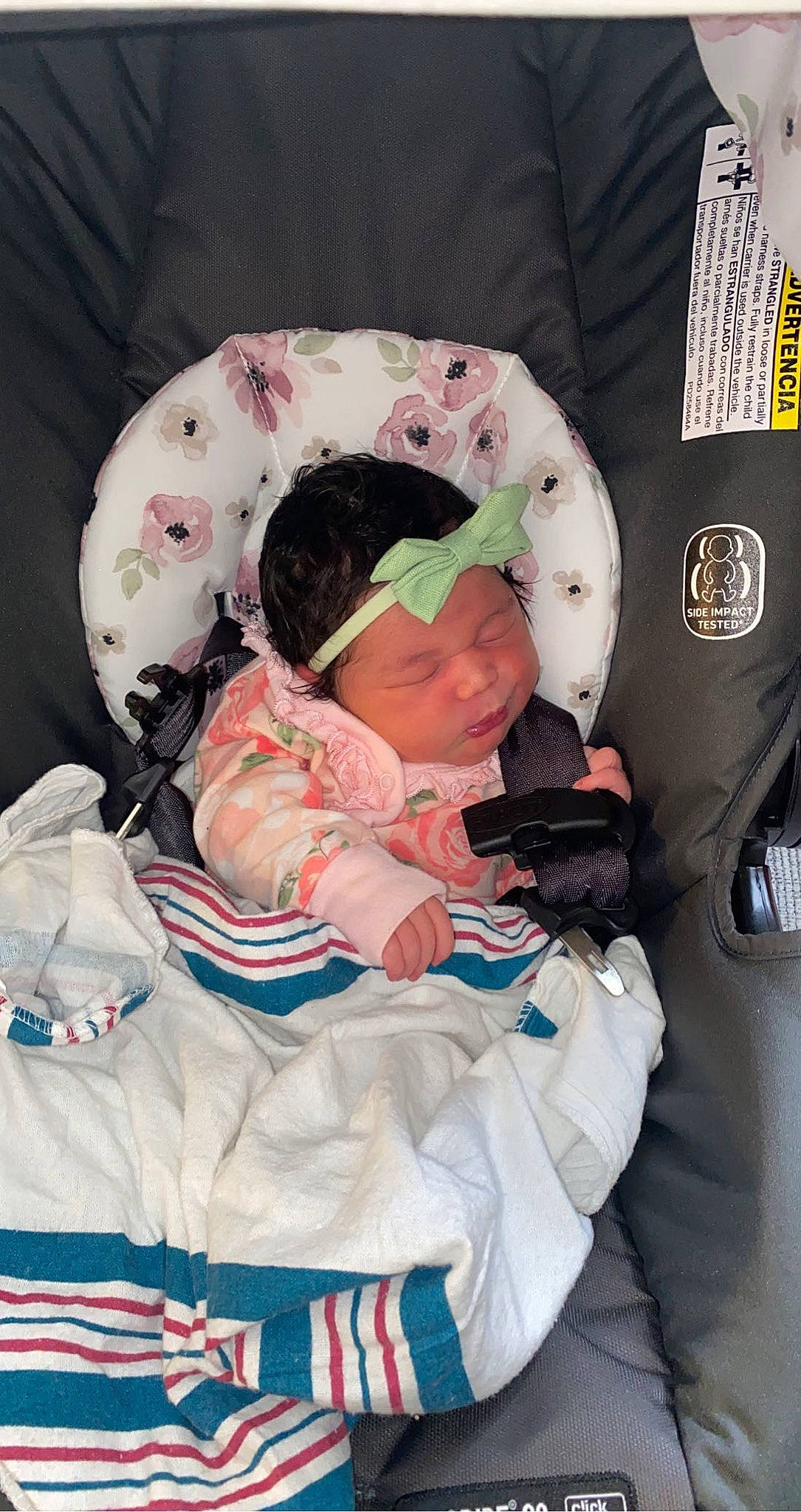 Zendaya is registered to the contest to win money with this photo: baby, baby_carriage, baby_products, baby_safety, baby_sleeping, baby_toddler_clothing, beanie, cap, car_seat, child, comfort, head, headwear, knit_cap, lap, linens, person, sitting, sleeve, toddler