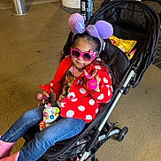 Isabella is registered to the contest to win money with this photo: accessories, child, clothing, face, female, footwear, girl, happy, hat, head, pants, person, photography, portrait, selfie, shoe, smile, stroller, sunglasses, toy