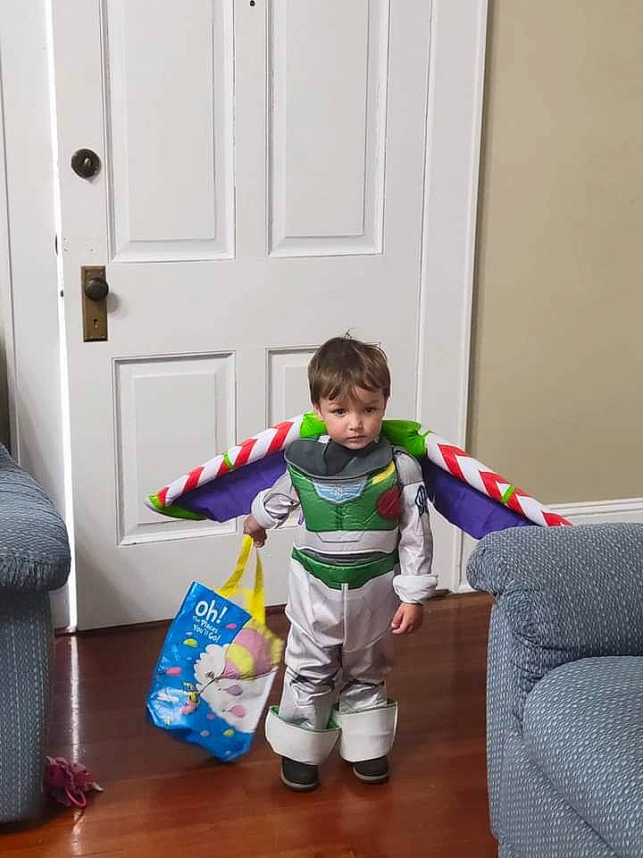 Xavier joined the competition — help win amazing prizes! baby_toddler_clothing, boot, carmine, comfort, couch, door, floor, flooring, fun, holiday, leg, living_room, person, play, room, sitting, sleeve, sweatpant, t_shirt, toddler