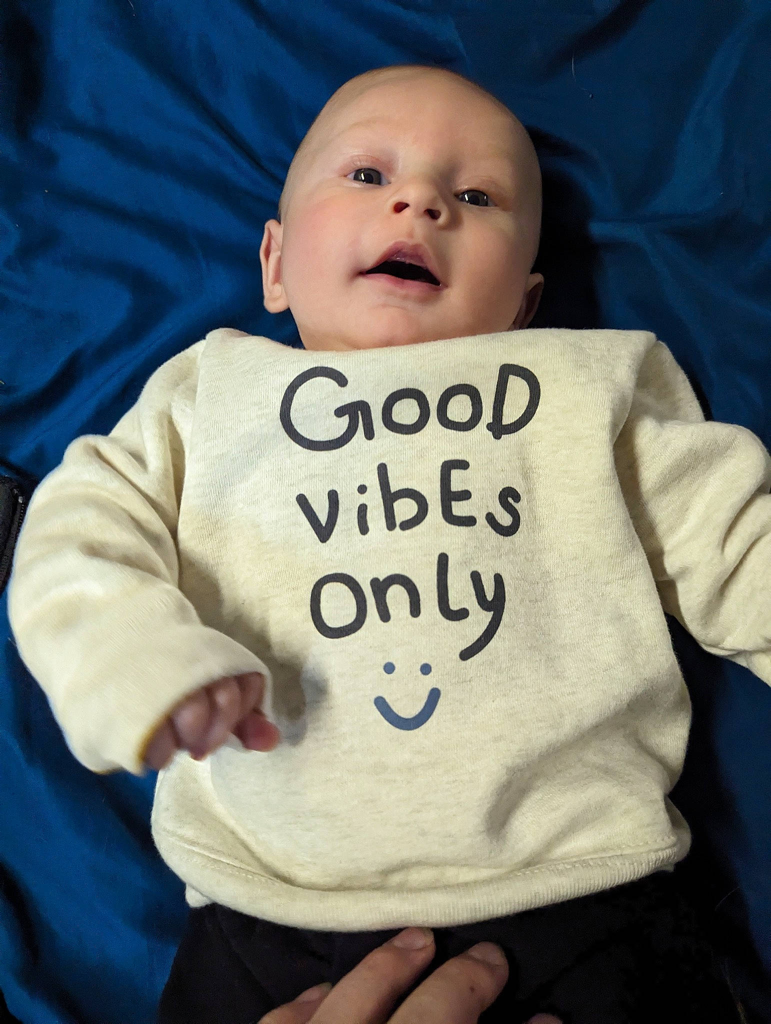 Tony joined the competition — help win amazing prizes! baby, baby_sleeping, baby_toddler_clothing, cheek, child, eye, face, font, gesture, happy, nose, outerwear, person, product, skin, sleeve, smile, t_shirt, textile, thumb