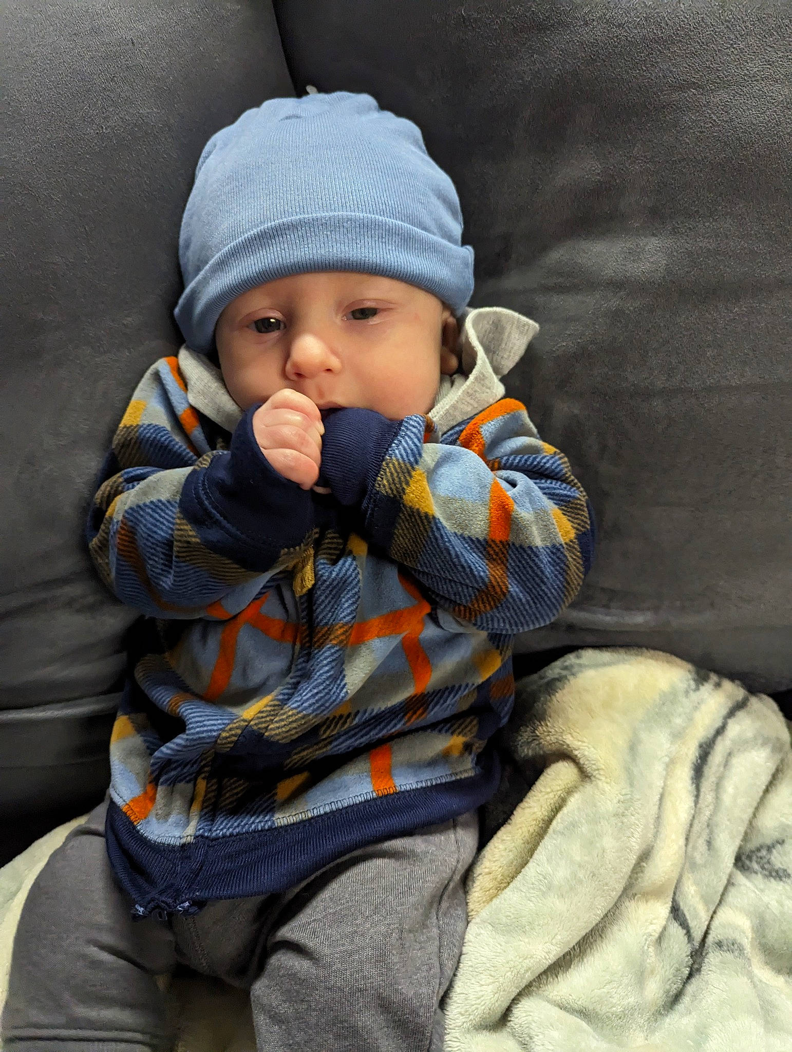 Tony joined the competition — help win amazing prizes! baby, baby_carriage, baby_products, baby_toddler_clothing, beanie, cap, cheek, child, comfort, face, freezing, headwear, knit_cap, outerwear, person, sitting, sleeve, textile, toddler, vacation