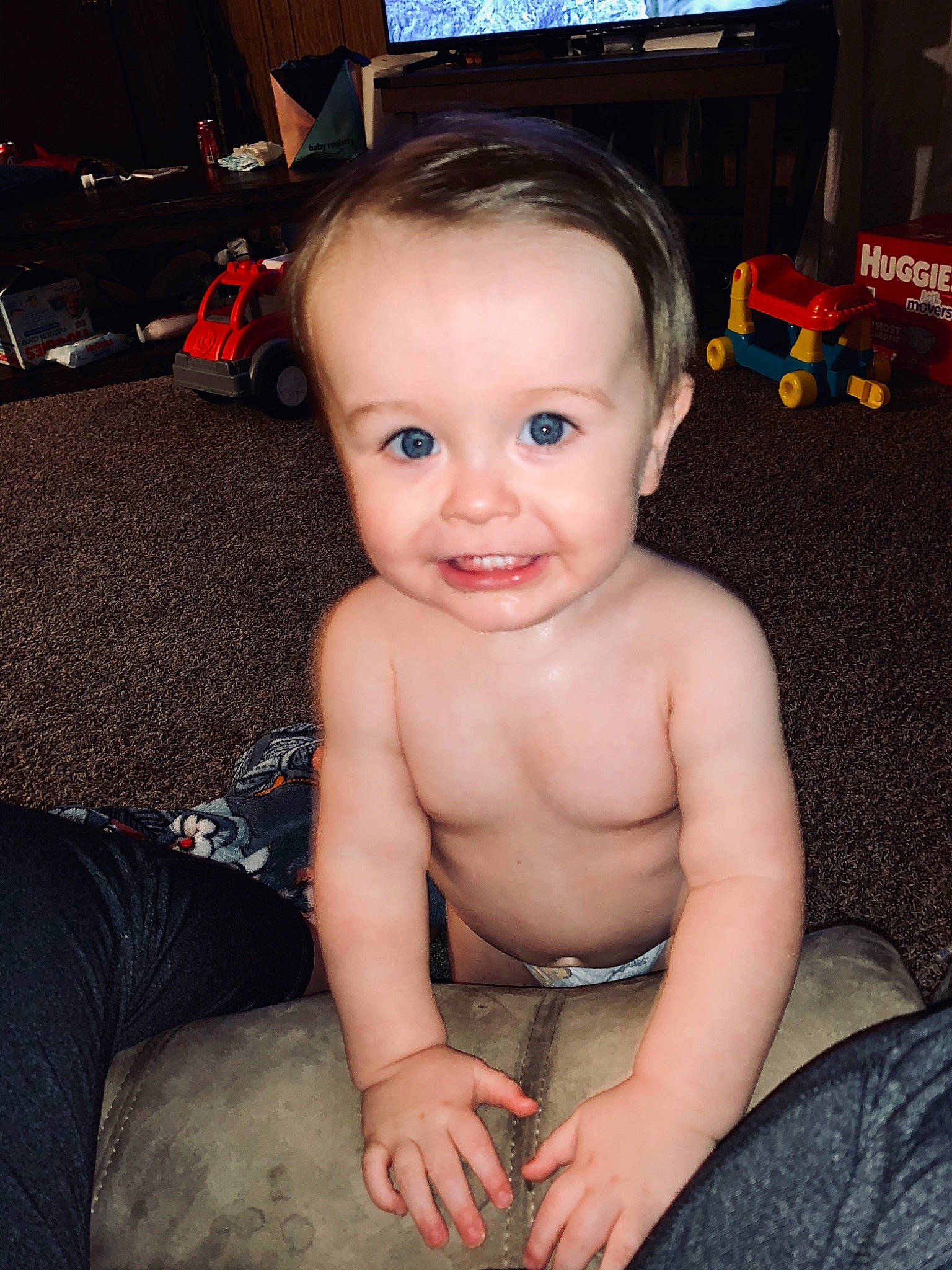 Oliver is registered to the contest to win money with this photo: abdomen, baby, baby_toddler_clothing, barechested, cheek, chest, child, display_device, ear, flat_panel_display, joy, lcd_tv, living_room, nose, person, sitting, stomach, television_set, thumb, toddler