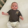Charlie joined the competition — help win amazing prizes! baby, crib, smile, infant, clothing, pajamas, face, child, person, bed, room, happy, cute, palm_tree, sleeves, light, skin, lying_down, indoors, nursery