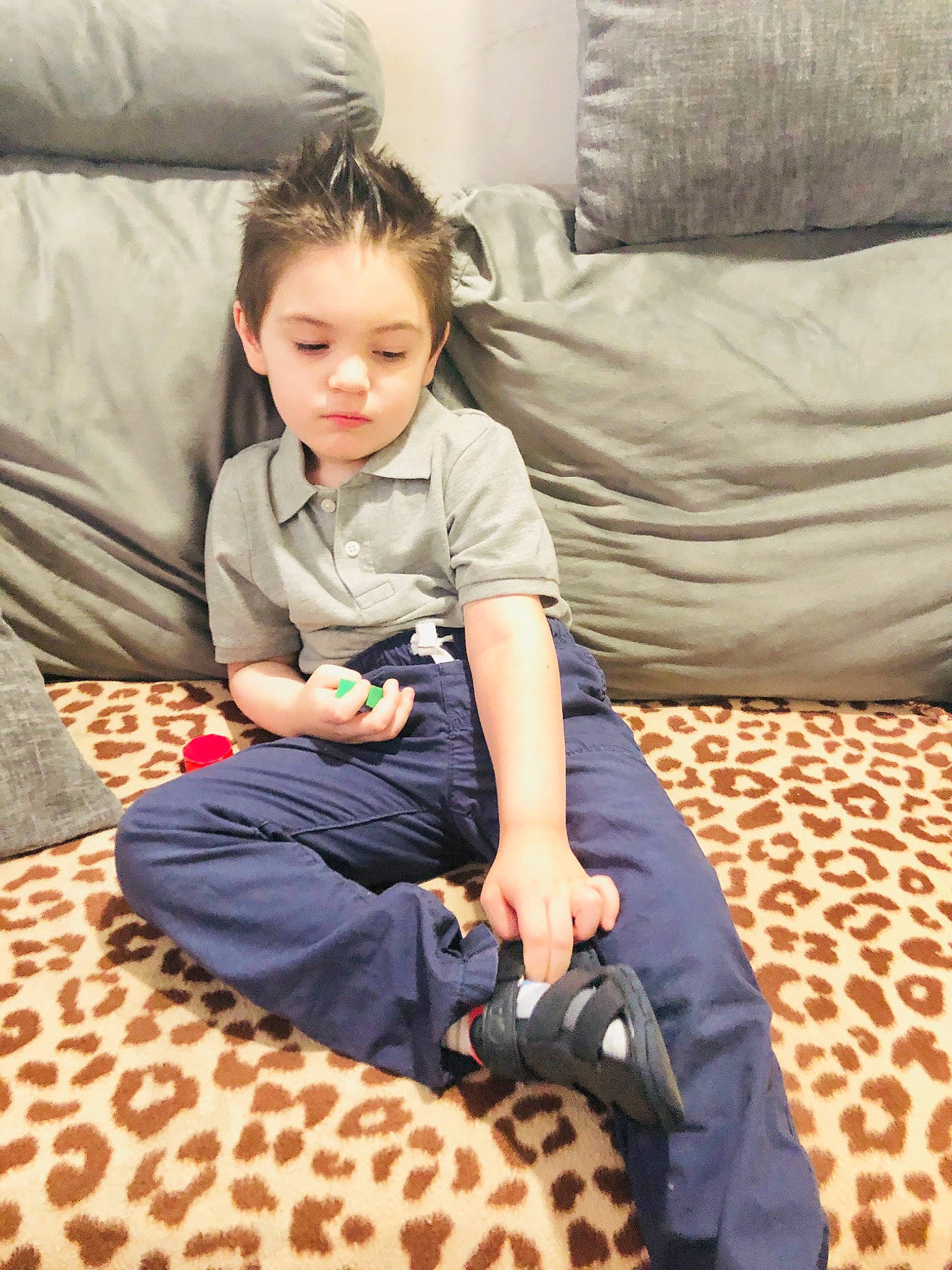 Evan joined the competition — help win amazing prizes! child, comfort, couch, floor, flooring, fun, hardwood, human_leg, knee, lap, leisure, linens, living_room, mammal, person, room, sitting, textile, thigh, toddler