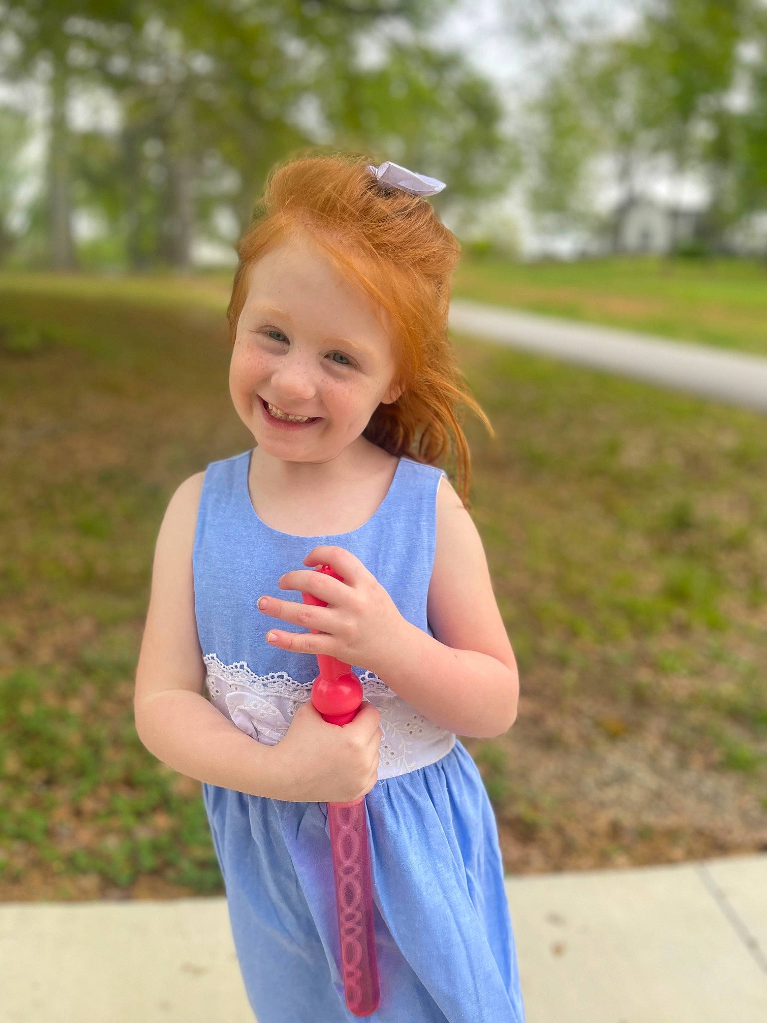 Chloee is registered to the contest to win money with this photo: arm, blond, child, day_dress, electric_blue, fun, goggles, grass, happy, joy, magenta, people_in_nature, person, pink, plant, recreation, smile, street_fashion, sunglasses, toddler