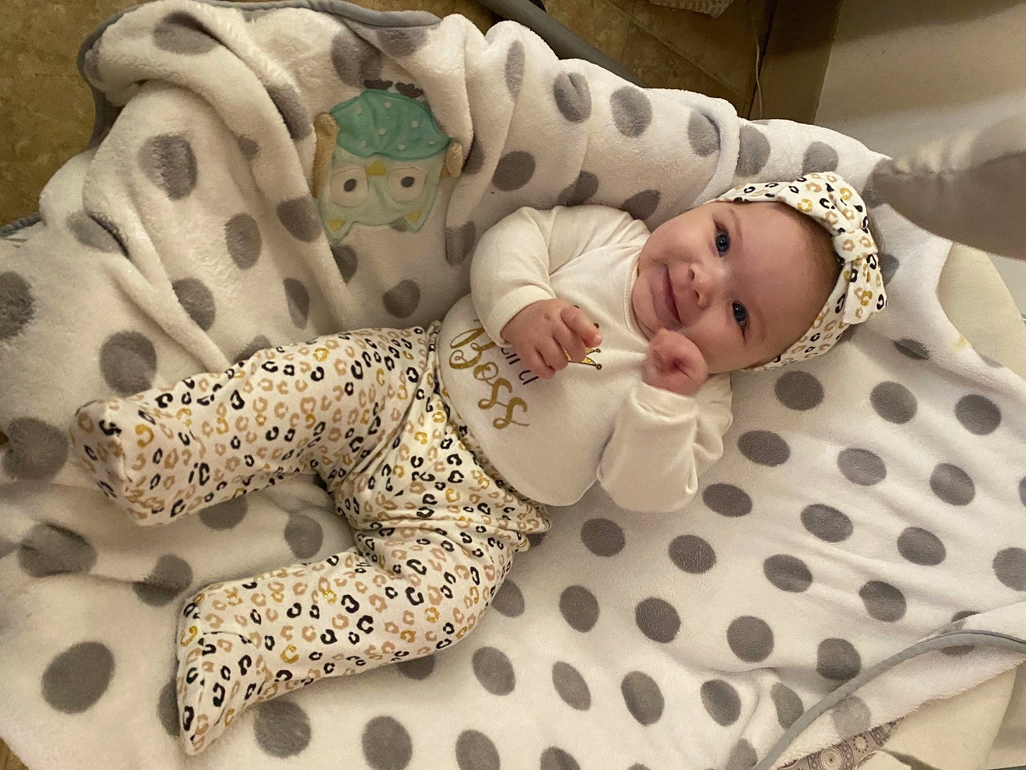 Thea is registered to the contest to win money with this photo: baby, baby_products, baby_safety, baby_sleeping, baby_toddler_clothing, bedding, child, comfort, fawn, flooring, fur, joy, linens, pattern, person, plush, sleeve, stuffed_toy, textile, toddler