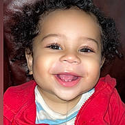 Chozen joined the competition — help win amazing prizes! baby, casual, child, clothing, curly_hair, cute, drool, expression, face, happy, indoor, leather_background, person, portrait, red_jacket, sitting, smile, teeth, toddler, young_child