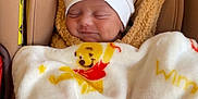 Kayden a rejoint le concours — aidez-le/la à gagner de superbes lots ! baby, sleeping, blanket, winnie_the_pooh, hat, car_seat, cozy, child, infant, cute, smiling, brown, white, soft, wrapped, hooded_blanket, peaceful, adorable, clothing, portrait