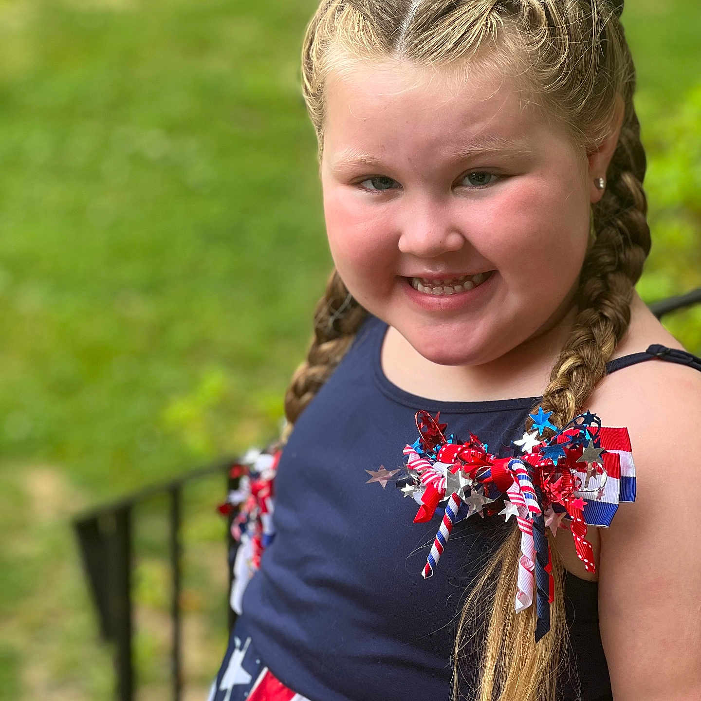Rilynn is registered to the contest to win money with this photo: blonde, braid, child, clothing, costume, dress, face, female, girl, grass, hair, happy, head, lawn, outdoors, person, photography, plant, portrait, smile