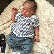 Jayce joined the competition — help win amazing prizes! baby, blanket, clothing, couch, cushion, electronics, face, furniture, head, hosiery, jeans, mobilephone, newborn, pants, person, phone, photography, portrait, remotecontrol, sock