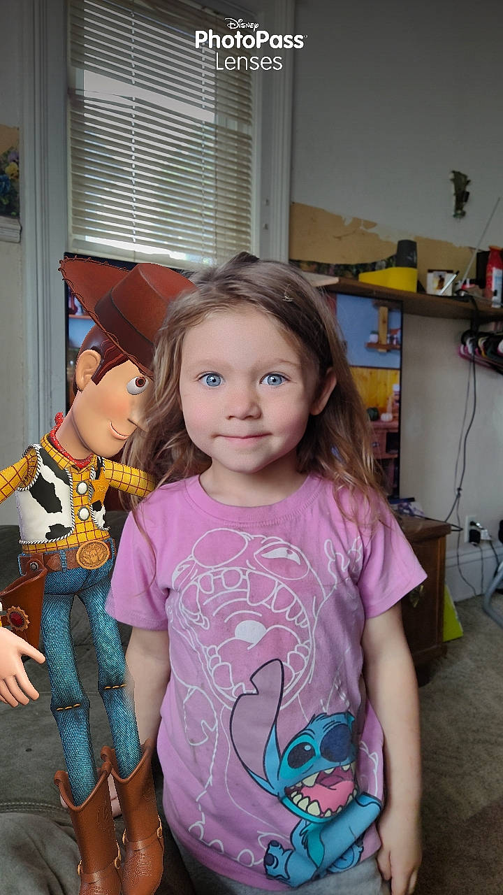 Chloe is registered to the contest to win money with this photo: child, cool, event, facial_expression, fun, happy, hat, joy, magenta, party, pattern, person, pink, purple, shoulder, skin, sleeve, standing, t_shirt, toddler