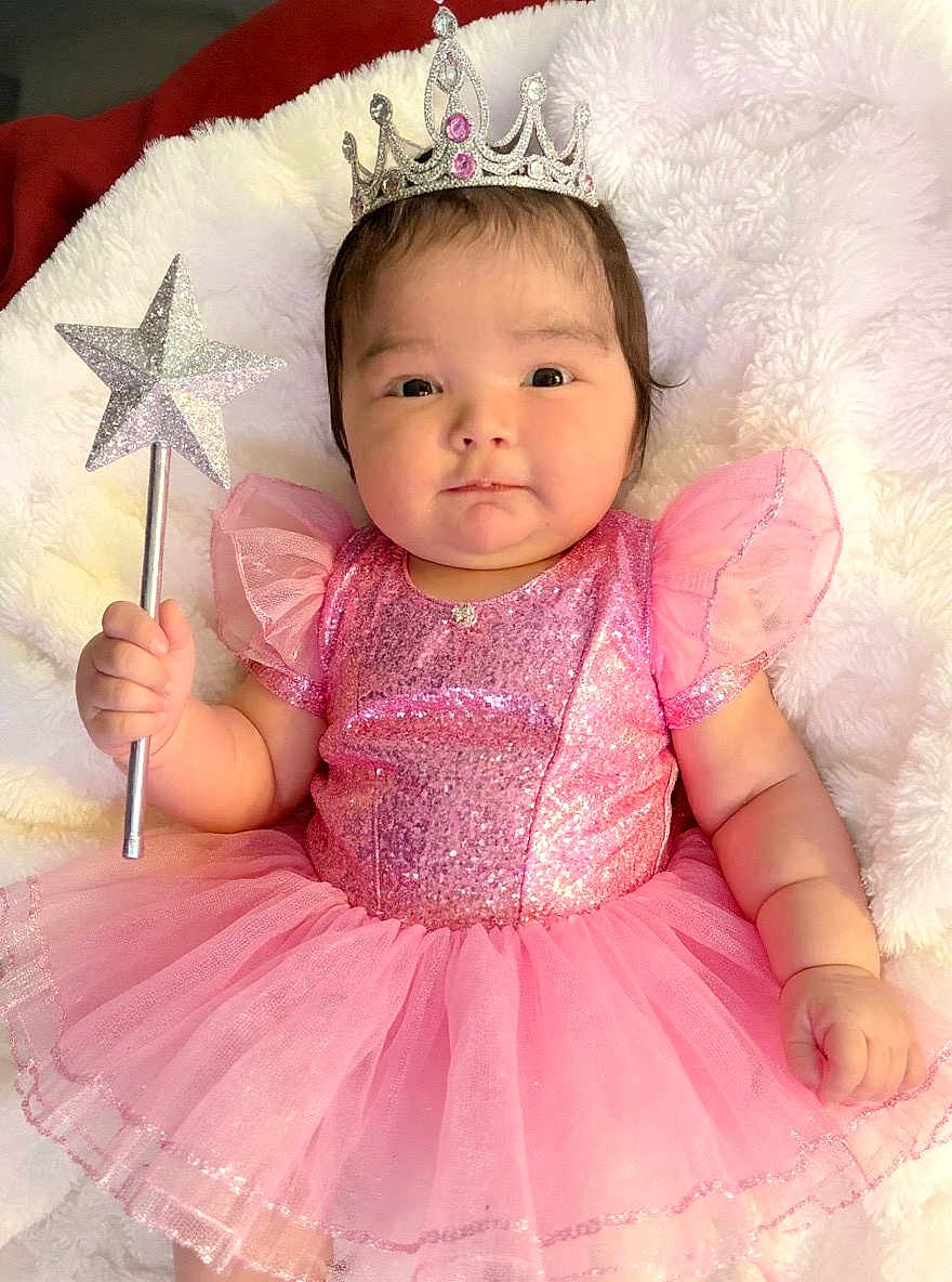 Madelyn joined the competition — help win amazing prizes! baby, child, crown, magic_wand, pink_dress, fairy_tale, sparkles, tulle_skirt, cute, portrait, indoor, soft_blanket, happy, smiling, young_child, infant, costume, celebration, dress_up, adorable