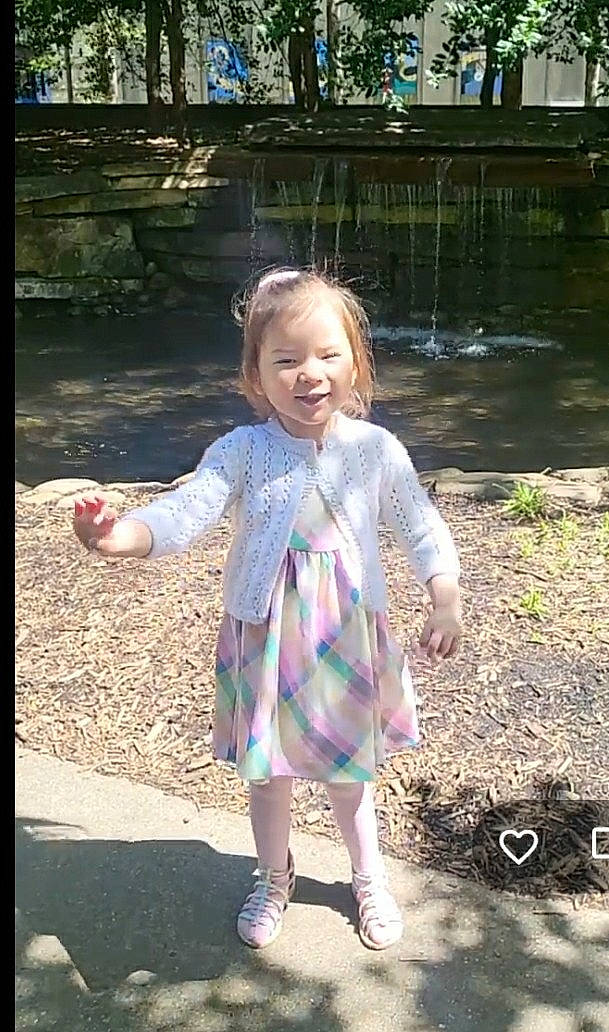 Primrose joined the competition — help win amazing prizes! blond, child, denim, dress, fun, gesture, grass, hand, happy, leaf, leisure, magenta, pattern, people_in_nature, person, pink, plant, recreation, smile, toddler