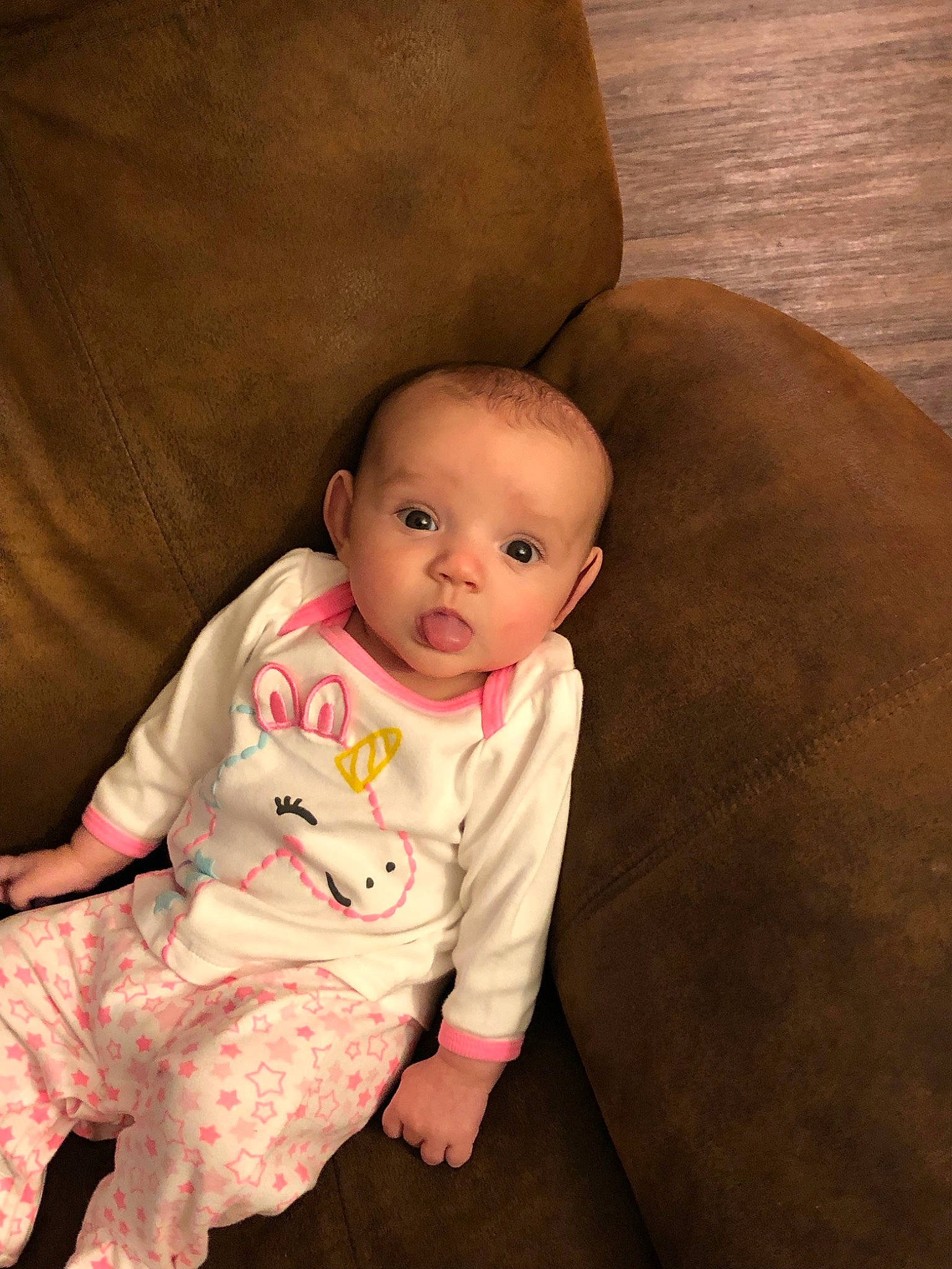 Rylie is registered to the contest to win money with this photo: baby, cheek, child, eye, head, iris, lip, person, pink, sitting, skin, toddler