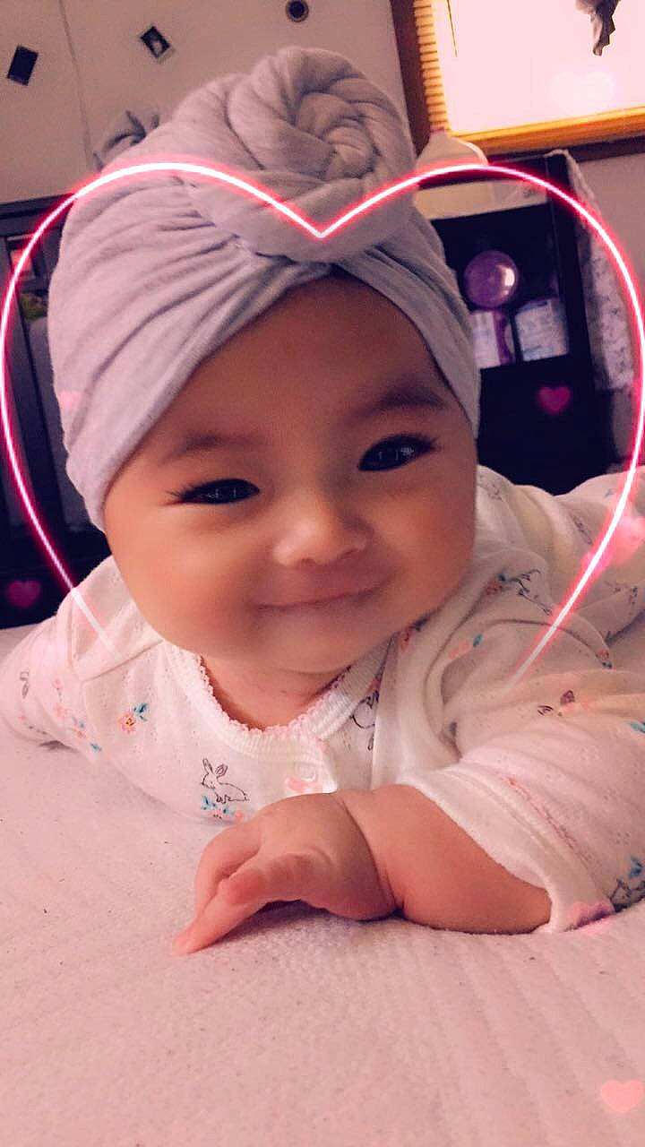 Dezire is registered to the contest to win money with this photo: baby, cheek, child, chin, daughter, ear, eye, eyebrow, face, forehead, head, headgear, joy, lip, mouth, nose, person, pink, skin, smile