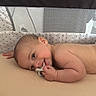 Sebastian joined the competition — help win amazing prizes! baby, blanket, child, comfort, crib, cute, furniture, hand, happy, head, indoors, infant, lying_down, mesh_side, pacifier, room, skin, sleeping_area, smiling, toddler