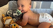 Sebastian joined the competition — help win amazing prizes! baby, child, cute, diaper, furniture, happy, head, indoor, infant, leopard_toy, mesh, pacifier, person, playpen, plush_toy, room, skin, smile, toy, zebra_toy