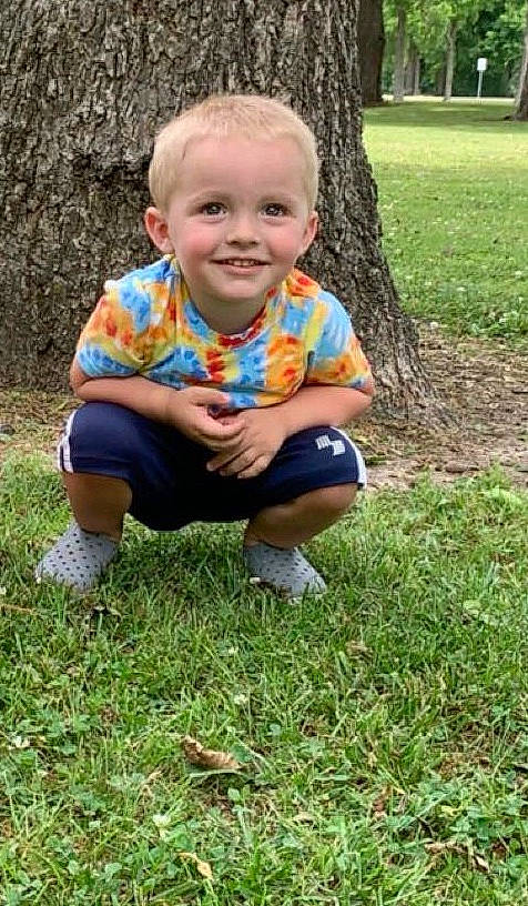 Jaxson is registered to the contest to win money with this photo: baby, baby_toddler_clothing, child, finger, foot, grass, joy, lap, pattern, people_in_nature, person, play, shoe, sitting, skin, slipper, sock, spring, thumb, toddler