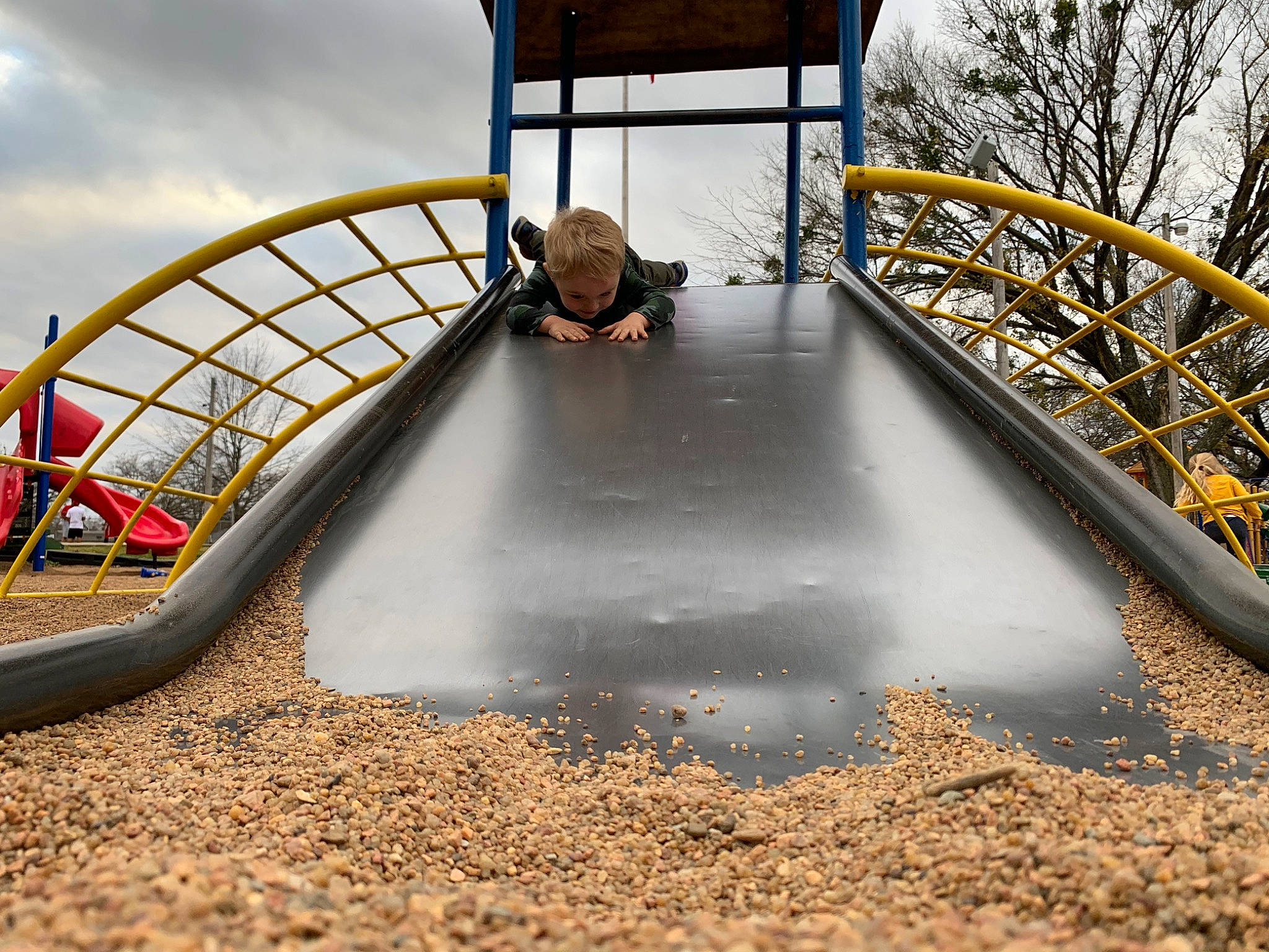 Jaxson joined the competition — help win amazing prizes! autumn, chute, city, guard_rail, handrail, human_settlement, iron, leisure, nonbuilding_structure, outdoor_play_equipment, person, play, playground, playground_slide, public_space, stairs, yellow