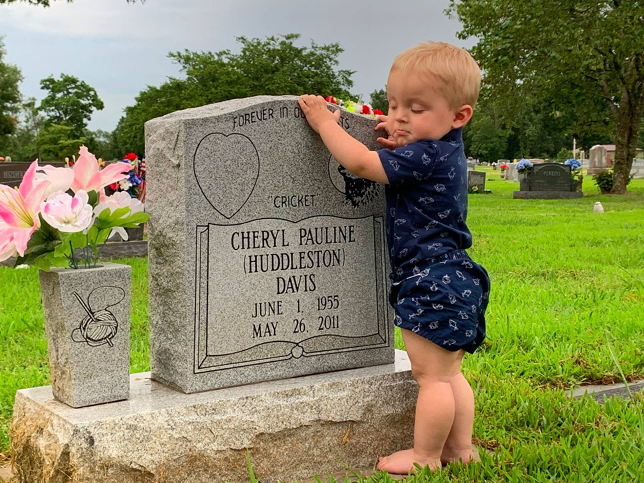 Jaxson joined the competition — help win amazing prizes! cemetery, child, granite, grass, grave, headstone, leaf, memorial, nonbuilding_structure, person, plant, stele, stone_carving, toddler, tree