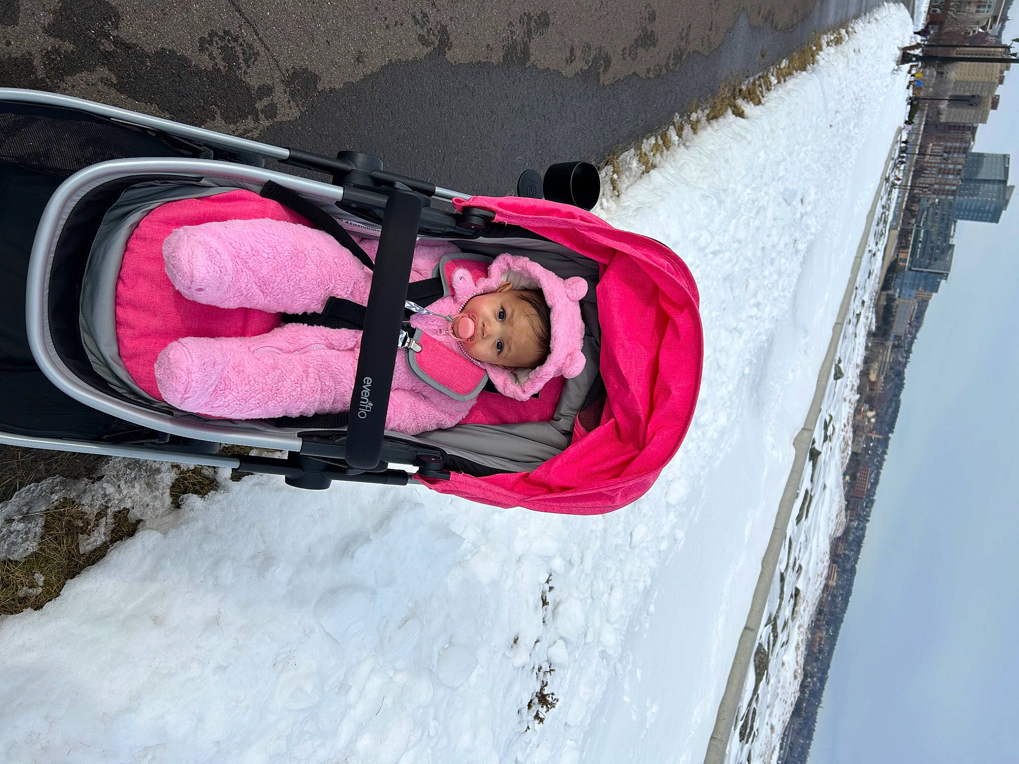 Maelani is registered to the contest to win money with this photo: adventure, automotive_exterior, family_car, freezing, fun, leisure, magenta, motor_vehicle, outdoor_shoe, person, recreation, sky, slope, snow, toddler, tree, vehicle, vehicle_door, window, windshield