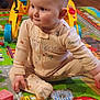 Alora is registered to the contest to win money with this photo: baby, bodypart, cream, dessert, face, finger, food, hand, head, icing, indoors, machine, person, photography, playarea, portrait, sitting, sweets, wheel, wood