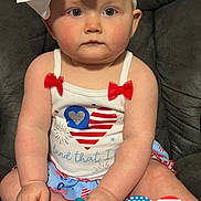 Alora is registered to the contest to win money with this photo: accessories, baby, cap, clothing, costume, couch, cushion, cutlery, face, furniture, hat, head, homedecor, person, photography, portrait, sitting, spoon, swimwear, t_shirt