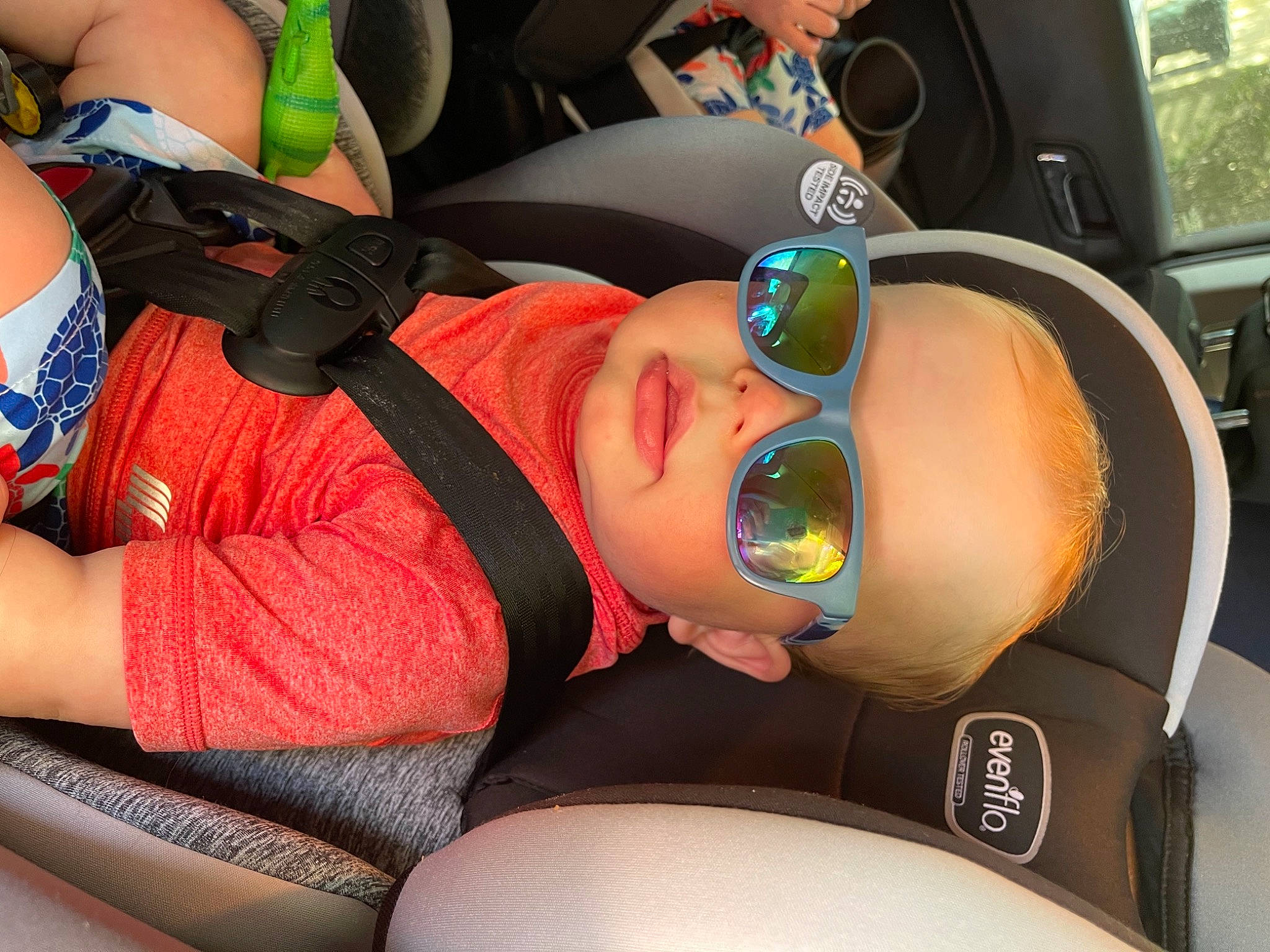 Gannon is registered to the contest to win money with this photo: car_seat, chest, comfort, cool, elbow, eyewear, glasses, goggles, hat, headgear, helmet, joint, knee, mouth, person, personal_protective_equipment, sunglasses, thigh, trunk, vehicle_door