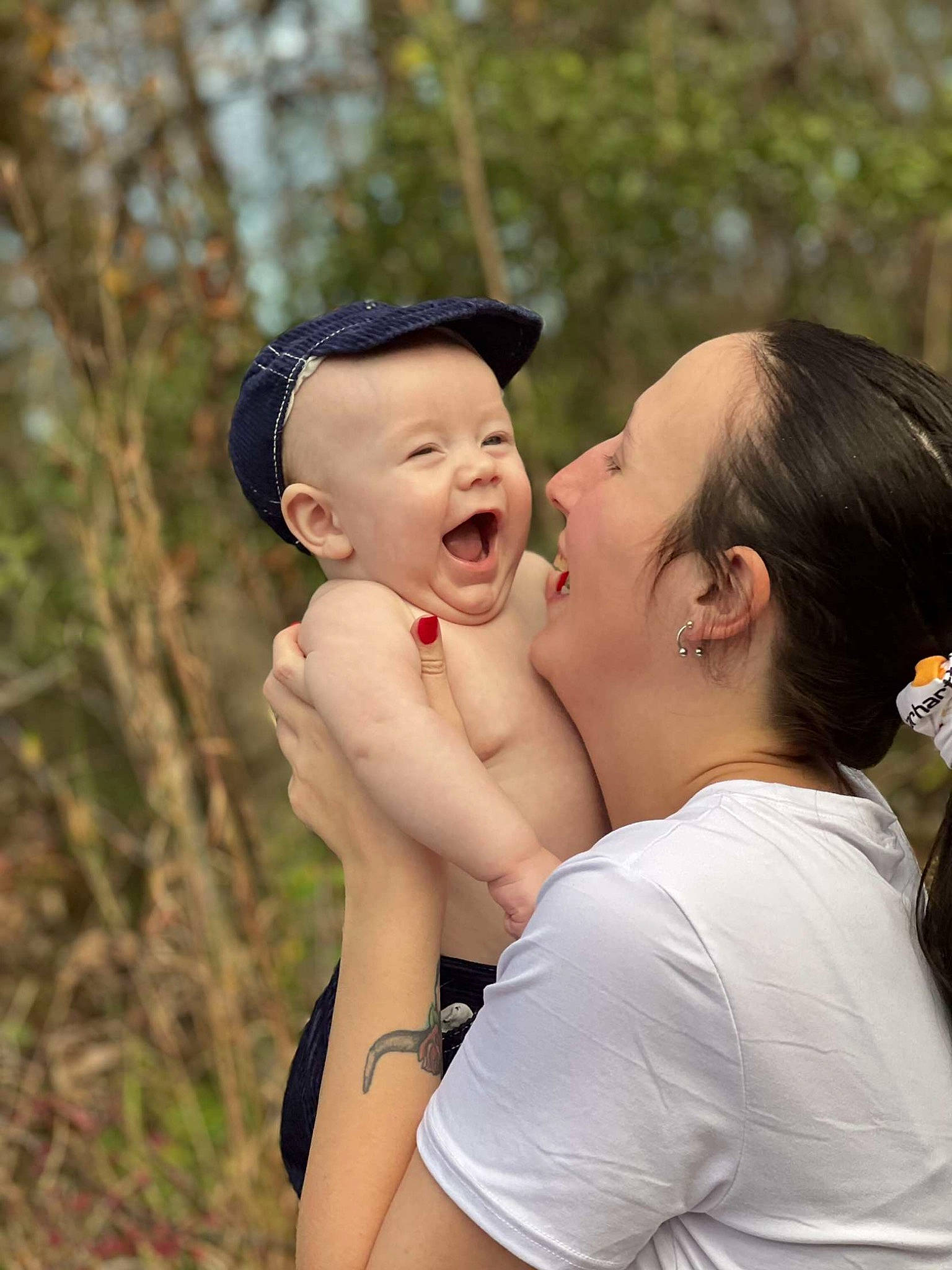 Colby is registered to the contest to win money with this photo: baby, cap, chest, child, event, flash_photography, fun, gesture, grass, happy, hug, jewellery, leisure, people_in_nature, person, recreation, romance, shoulder, smile, toddler