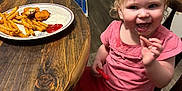 Mara joined the competition — help win amazing prizes! casual, chicken_nuggets, child, dining, dips, flooring, food, french_fries, happy, home, indoor, meal, person, pink_clothing, plate, smiling, toddler, toy, wooden_chair, wooden_table