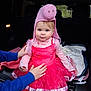 blanket, blue_eyes, car_interior, child, clothing, costume, cute, fun, hands, long_sleeves, person, pig_hat, pink_dress, playful, portrait, sitting, soft_lighting, toddler, vehicle, young_child