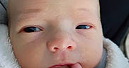 Grayson joined the competition — help win amazing prizes! baby, bald, blanket, blue_eyes, cheeks, child, close_up, cozy, cuddly, eyes, face, finger, indoors, infant, mouth, newborn, nose, photography, portrait, wrapped
