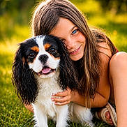 Atom participe au concours pour gagner de l'argent avec cette photo : blue_eyes, cavalier_king_charles_spaniel, child, close_up, cute, dog, friendship, grass, grass_field, happy, hugging, long_hair, nature, outdoor, pet, playful, portrait, smiling, summer, sunlight