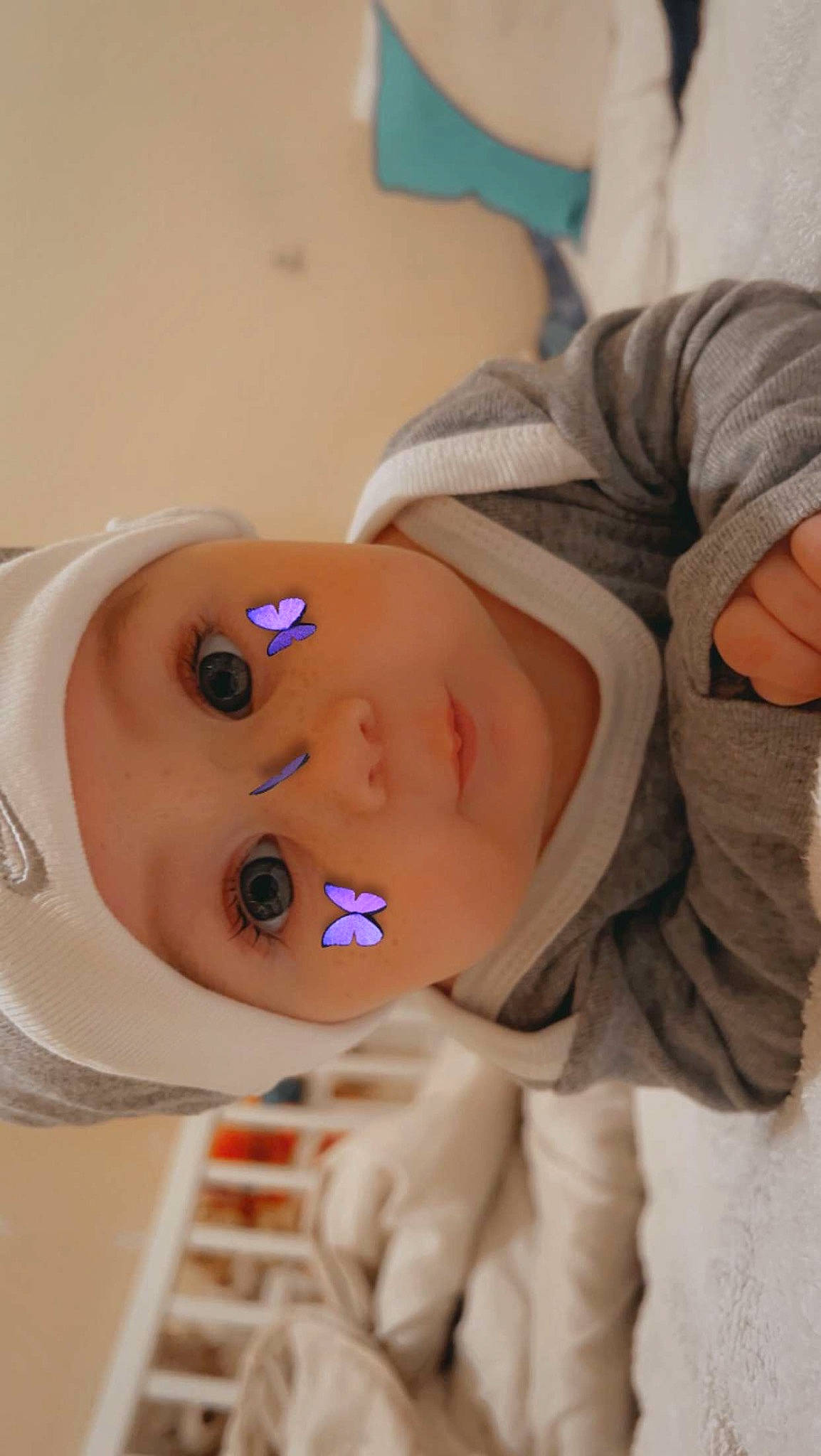 Héloïse a rejoint le concours — aidez-le/la à gagner de superbes lots ! baby, baby_products, baby_sleeping, baby_toddler_clothing, cheek, child, doll, eye, eyelash, face, hat, head, headwear, human_body, nose, person, room, skin, toddler, toy