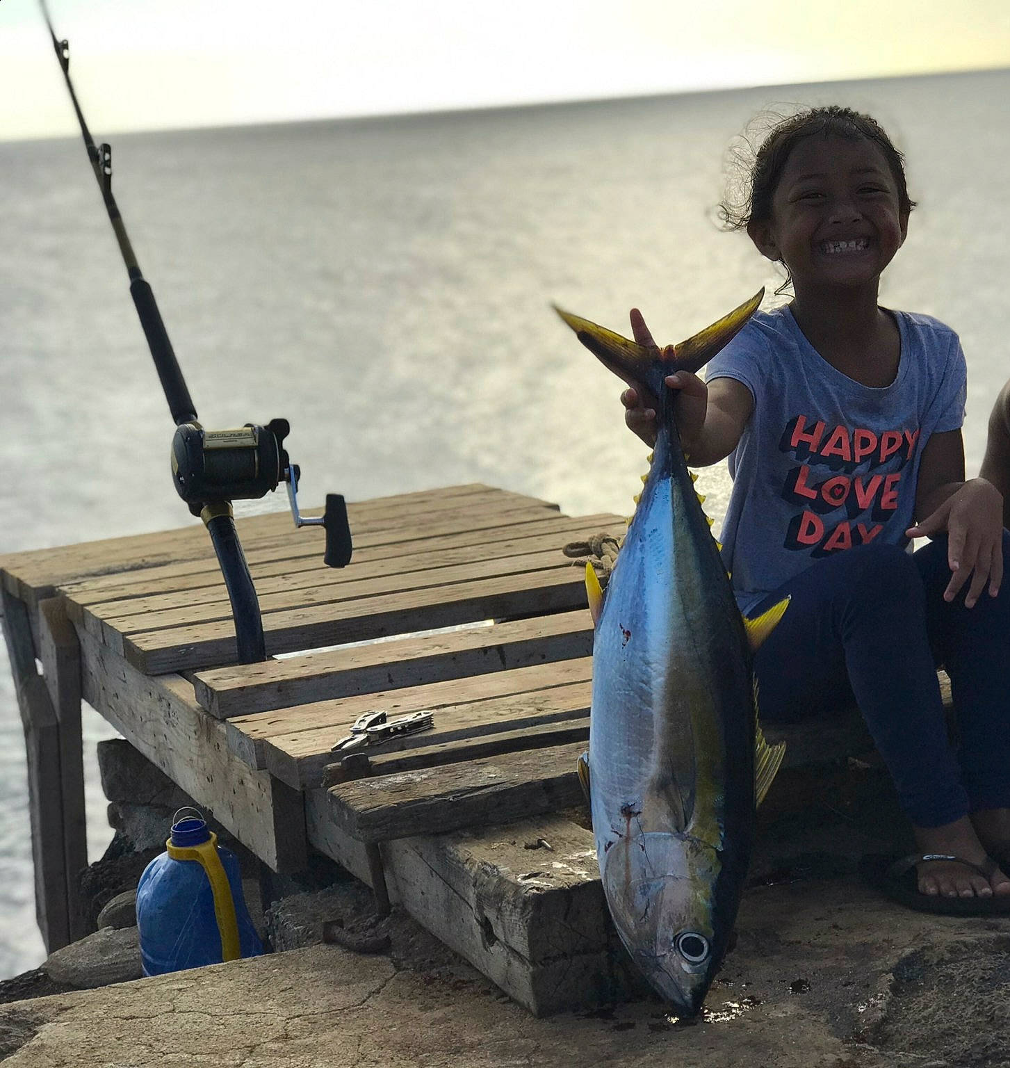 Amiliana is registered to the contest to win money with this photo: boats_and_boating_equipment_and_supplies, fin, fish, fisherman, fishing, happy, joy, lake, leisure, ocean, person, ray_finned_fish, recreation, recreational_fishing, seafood, smile, t_shirt, tourism, travel, under_exposed