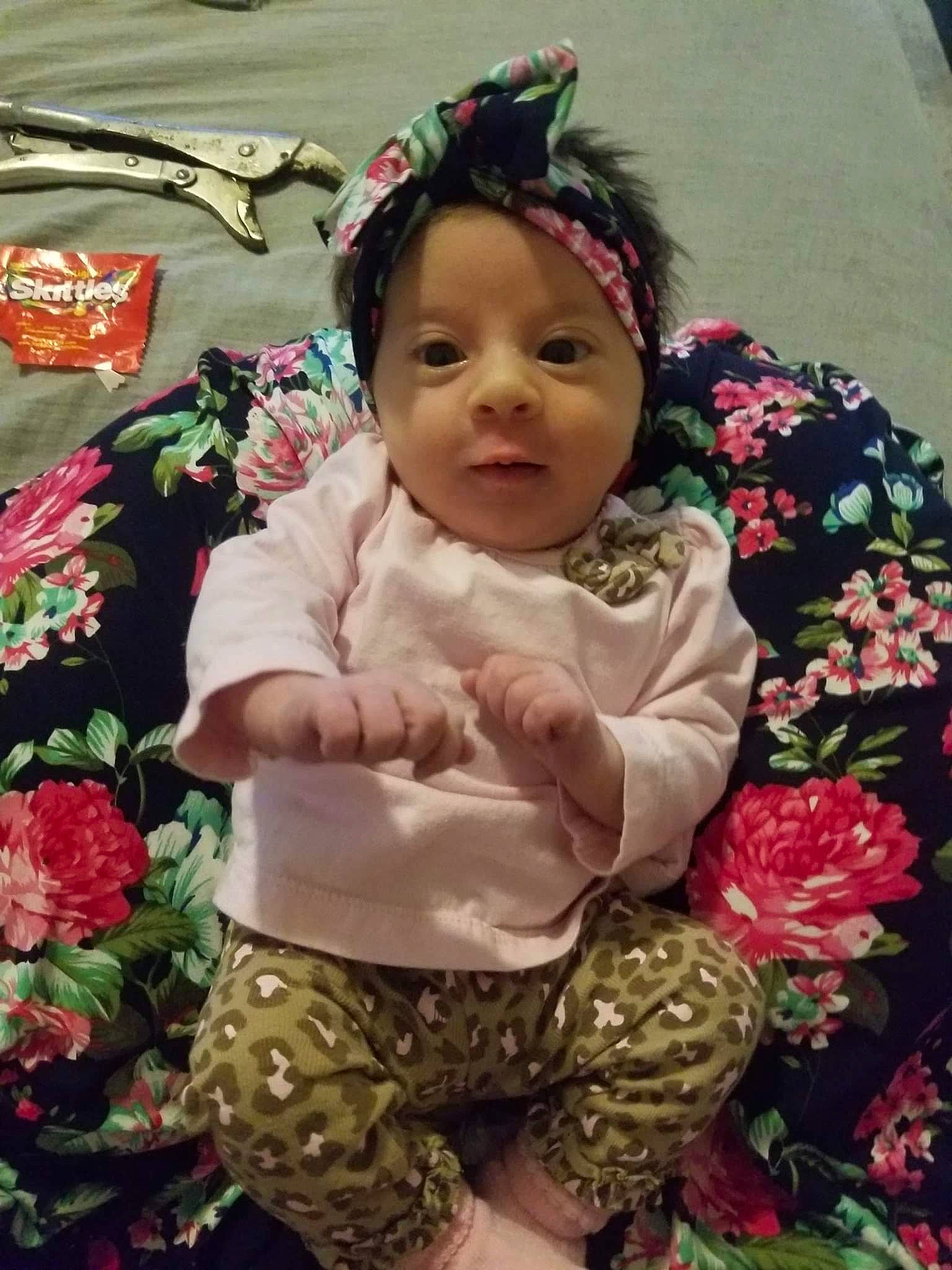 Paislee joined the competition — help win amazing prizes! baby, baby_toddler_clothing, beauty, cheek, child, event, floral_design, flower, flower_arranging, grass, happy, headwear, pattern, person, petal, pink, plant, rose, sitting, sleeve