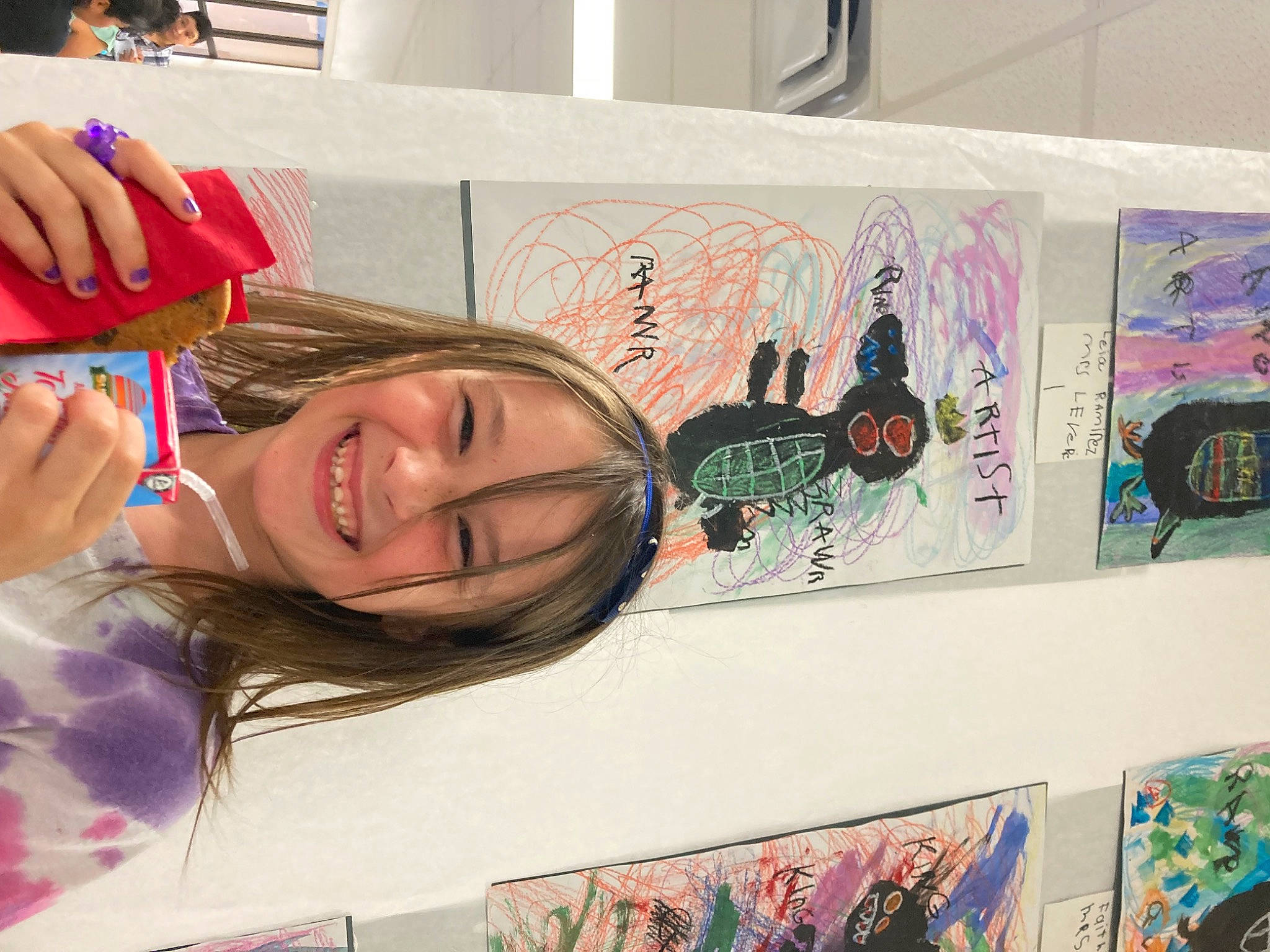 Vanessa is registered to the contest to win money with this photo: art, artist, cool, event, eyelash, eyewear, font, gesture, happy, illustration, joy, mouth, paint, painting, pattern, person, pink, product, smile, vision_care