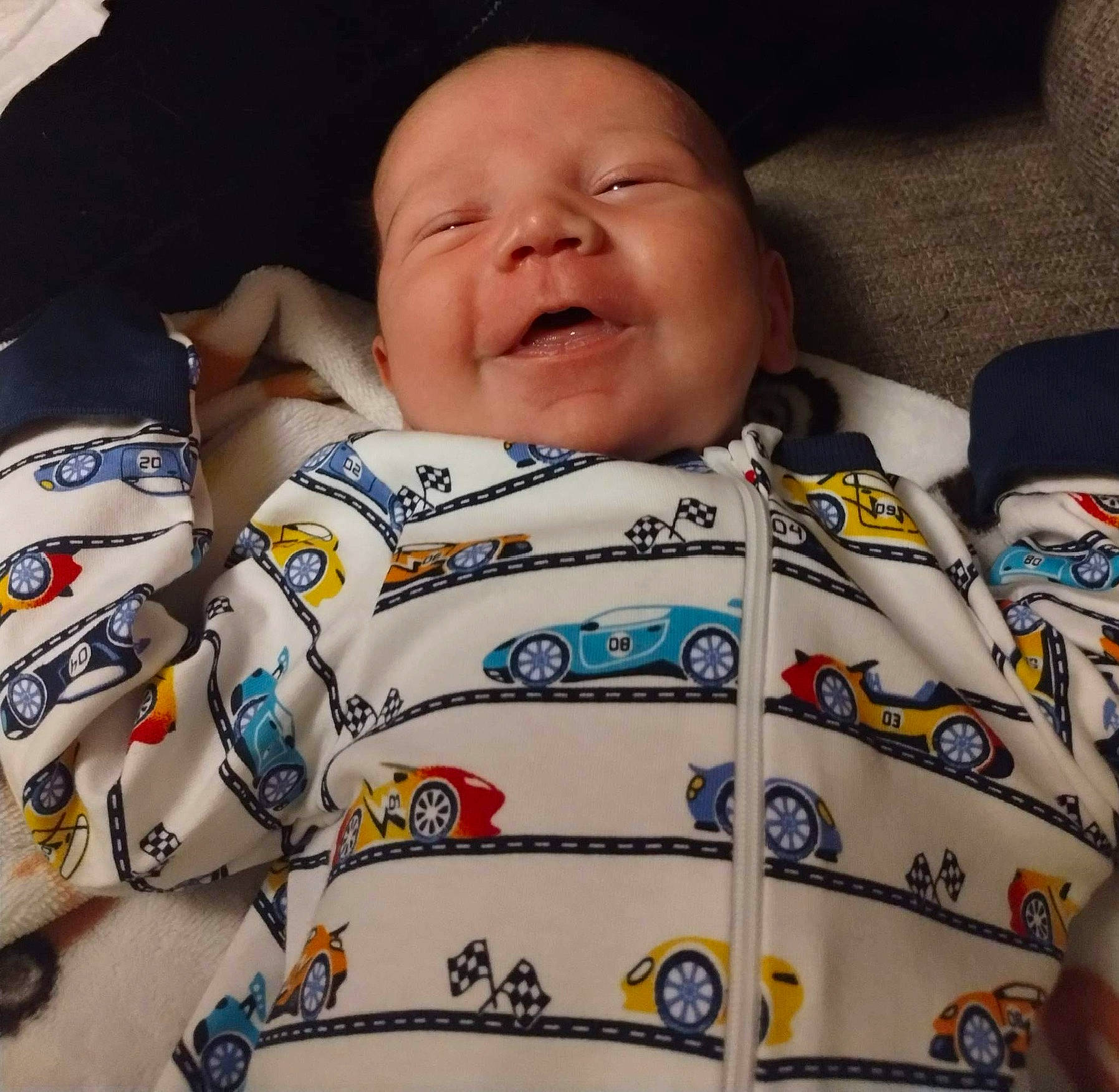 Xayvier is registered to the contest to win money with this photo: baby, baby_sleeping, baby_toddler_clothing, cheek, child, comfort, cool, face, facial_expression, happy, head, nose, organ, outerwear, person, product, skin, sleeve, smile, t_shirt