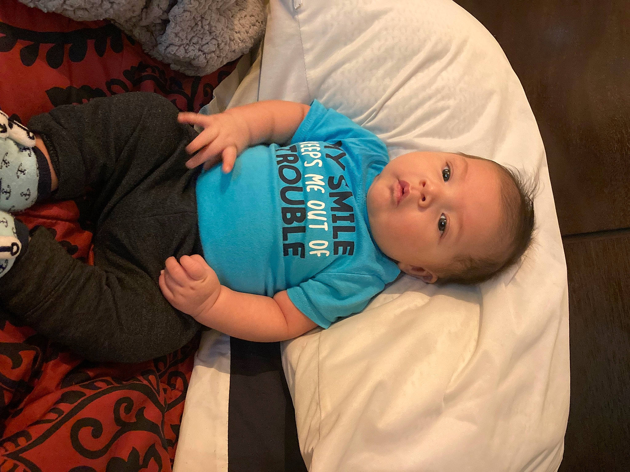 Archer is registered to the contest to win money with this photo: abdomen, arm, baby, baby_products, baby_toddler_clothing, child, comfort, couch, elbow, happy, hat, human_body, knee, person, room, sitting, sleeve, t_shirt, toddler, tree