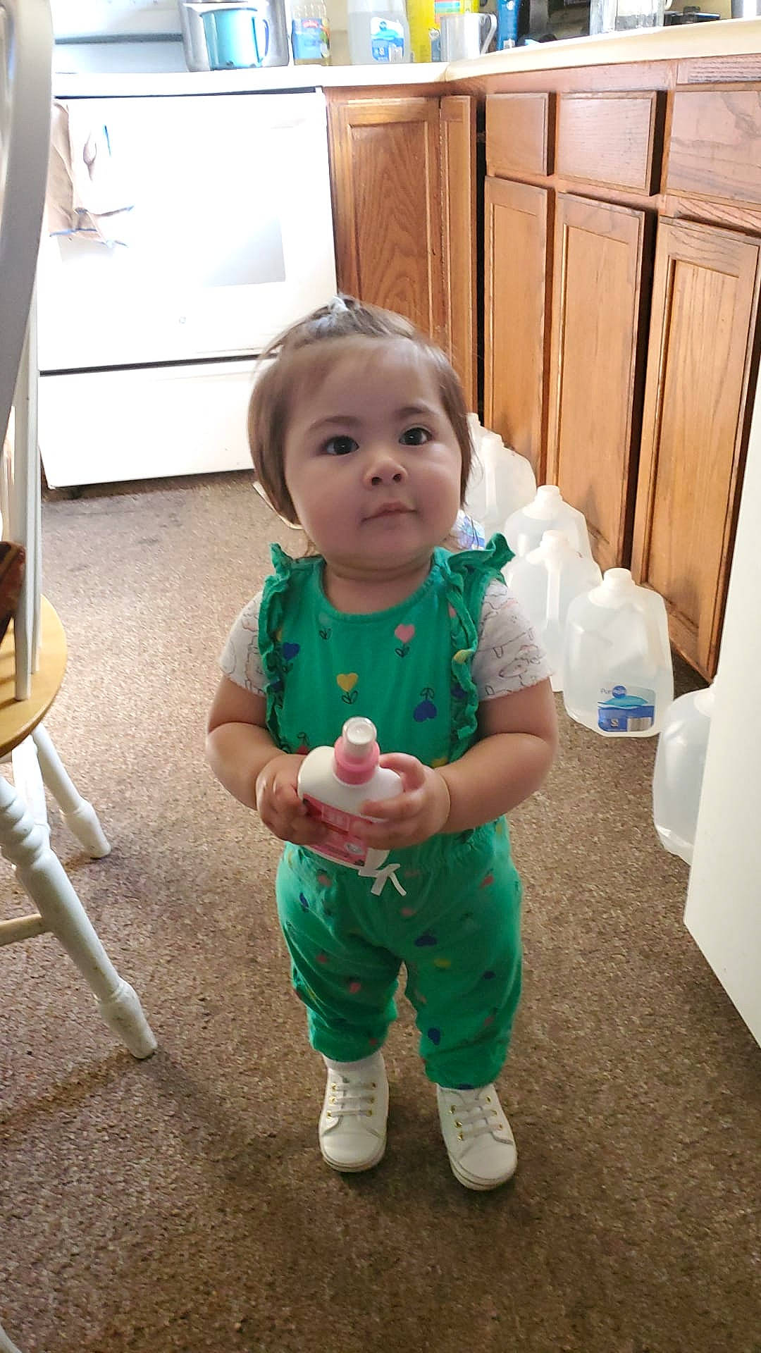 Maria is registered to the contest to win money with this photo: baby, baby_toddler_clothing, cabinetry, cheek, child, eye, floor, flooring, fun, happy, hardwood, joint, person, sitting, skin, sleeve, standing, textile, thumb, toddler