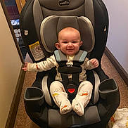 Michael joined the competition — help win amazing prizes! baby, car_seat, smiling, indoor, pajamas, animal_prints, child, seatbelt, happy, car_seat_harness, blanket, floor, carpet, person, face, infant, cute, safety, comfort, home