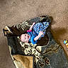Michael is registered to the contest to win money with this photo: baby, blanket, blue_clothing, carpet, child, crawling, cute, feet, floor, footwear, furniture, happy, home, indoor, infant, pattern, playful, smiling, striped_shirt, toy