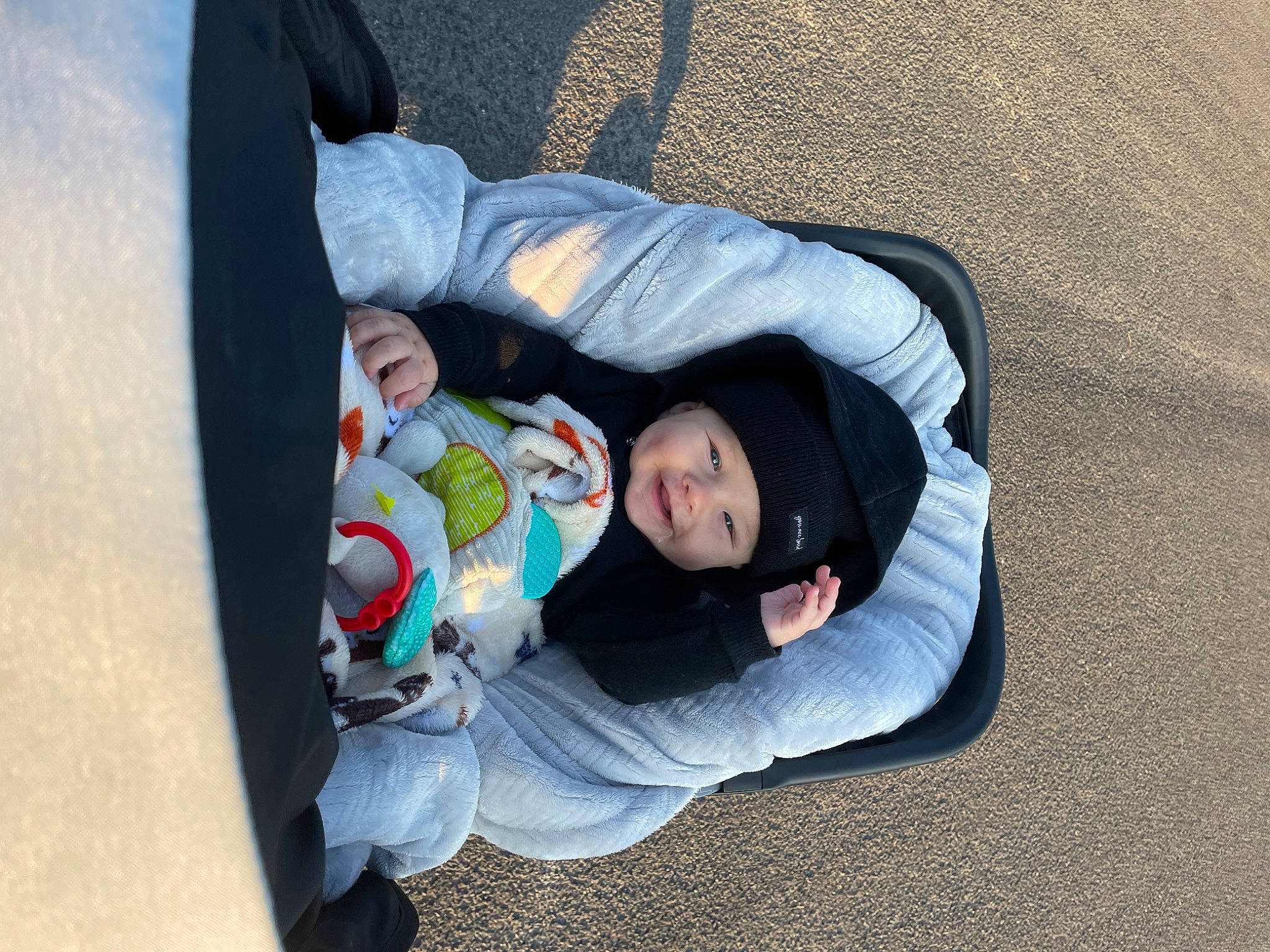 Bearon is registered to the contest to win money with this photo: baby, baby_carriage, baby_products, baby_toddler_clothing, child, comfort, fun, grass, headwear, leg, leisure, nap, person, sitting, smile, toddler, tree, walking_shoe, winter