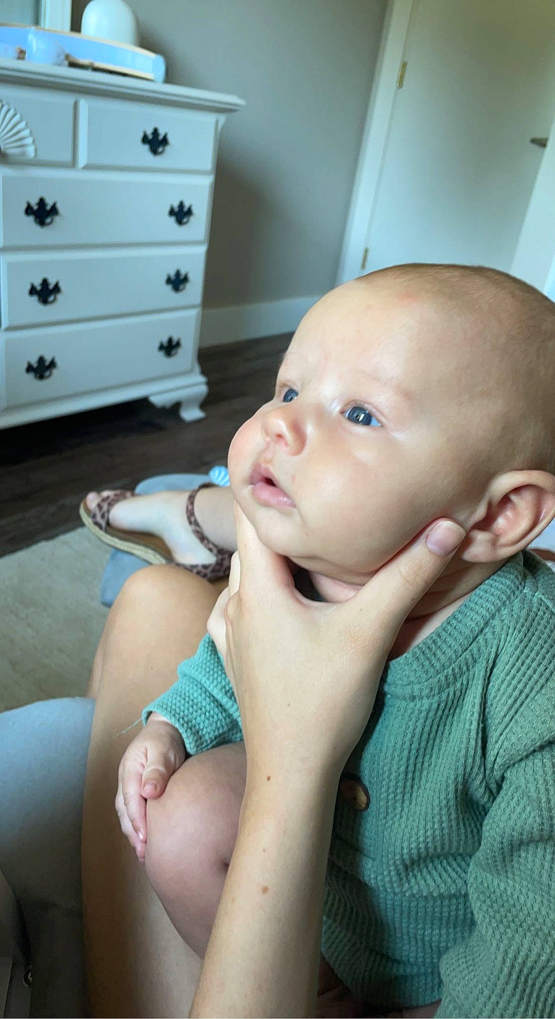 Bearon is registered to the contest to win money with this photo: baby, baby_toddler_clothing, black, blue, cabinetry, chair, cheek, chest_of_drawers, comfort, drawer, dresser, green, hand, happy, hardwood, person, skin, thumb, toddler, white