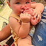 Mia joined the competition — help win amazing prizes! baby, child, foot, hand, skin, hair, outdoor, person, lap, clothing, denim, red_shorts, yellow_top, skin_tone, sitting, cute, expression, closeup, daylight, nature