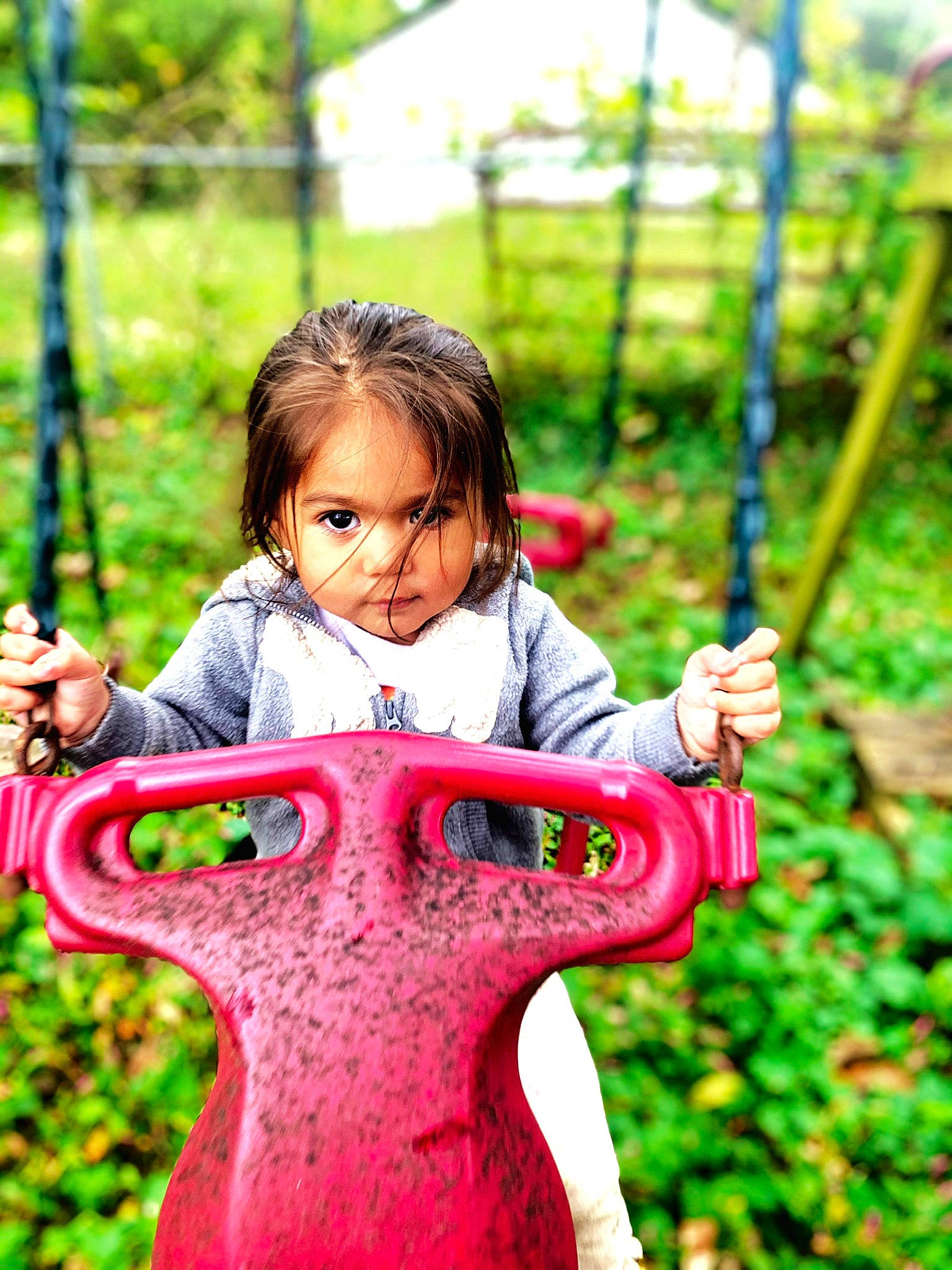 Adelina joined the competition — help win amazing prizes! botany, facial_expression, fun, grass, green, happy, leaf, leisure, nature, outdoor_play_equipment, people_in_nature, person, plant, playground, public_space, recreation, smile, summer, toddler, tree
