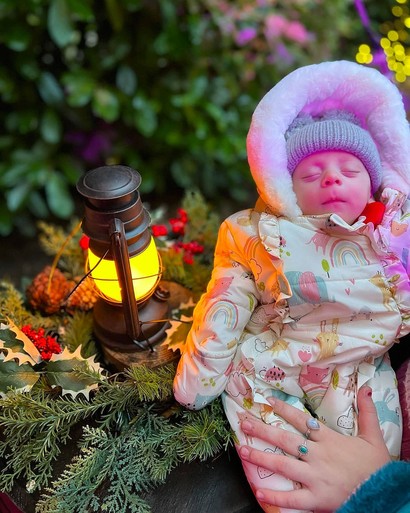 Hendrix is registered to the contest to win money with this photo: baby, baby_toddler_clothing, botany, cap, child, conifer, flower_arranging, grass, happy, hat, headgear, headwear, knit_cap, lawn_ornament, leaf, people_in_nature, person, plant, sitting, toddler