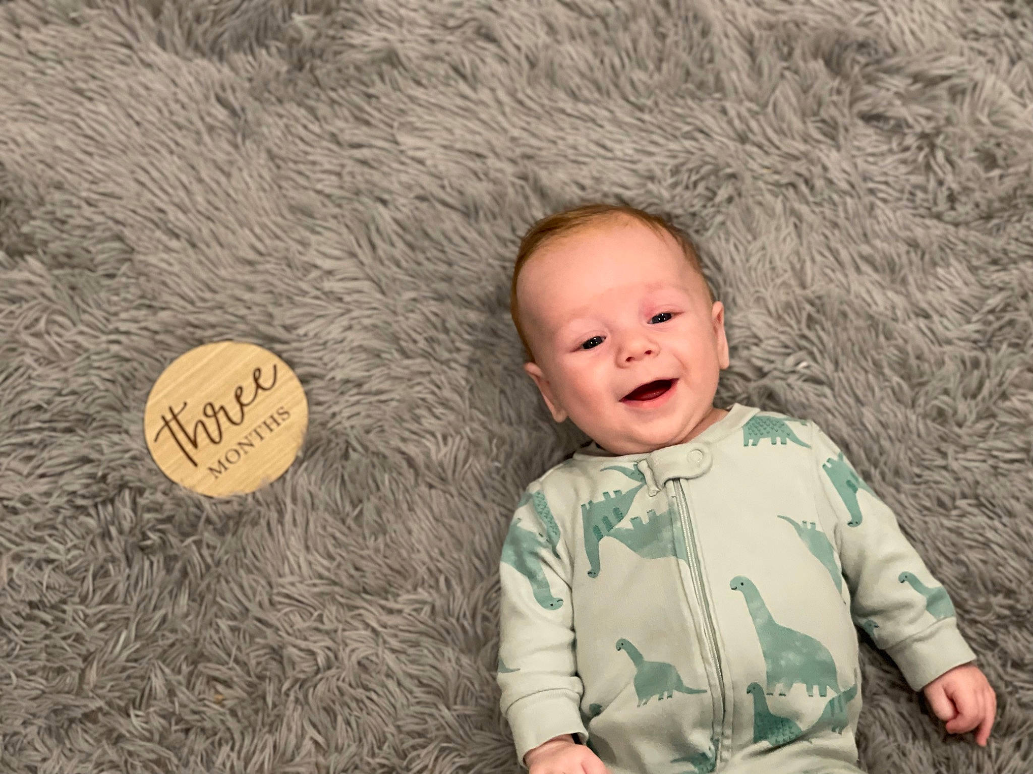 Kane is registered to the contest to win money with this photo: baby, baby_toddler_clothing, child, flash_photography, flooring, fun, fur, grass, happy, laugh, nose, people_in_nature, person, rock, sitting, skin, sleeve, smile, toddler, tree